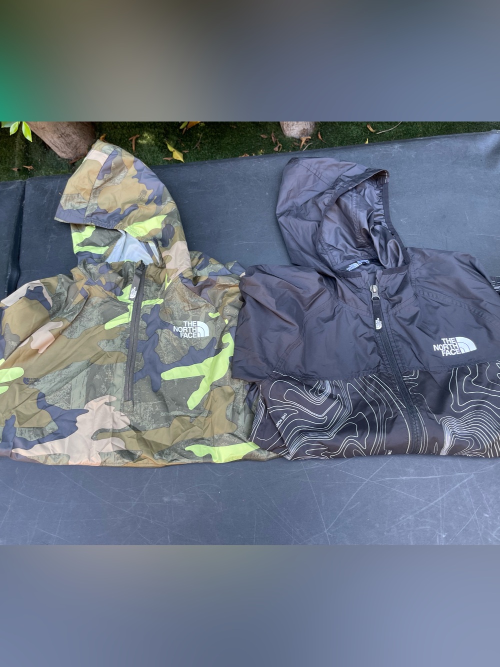 The North Face Hooded Windbreaker Jackets - Camouflage Green & Black
Bundle